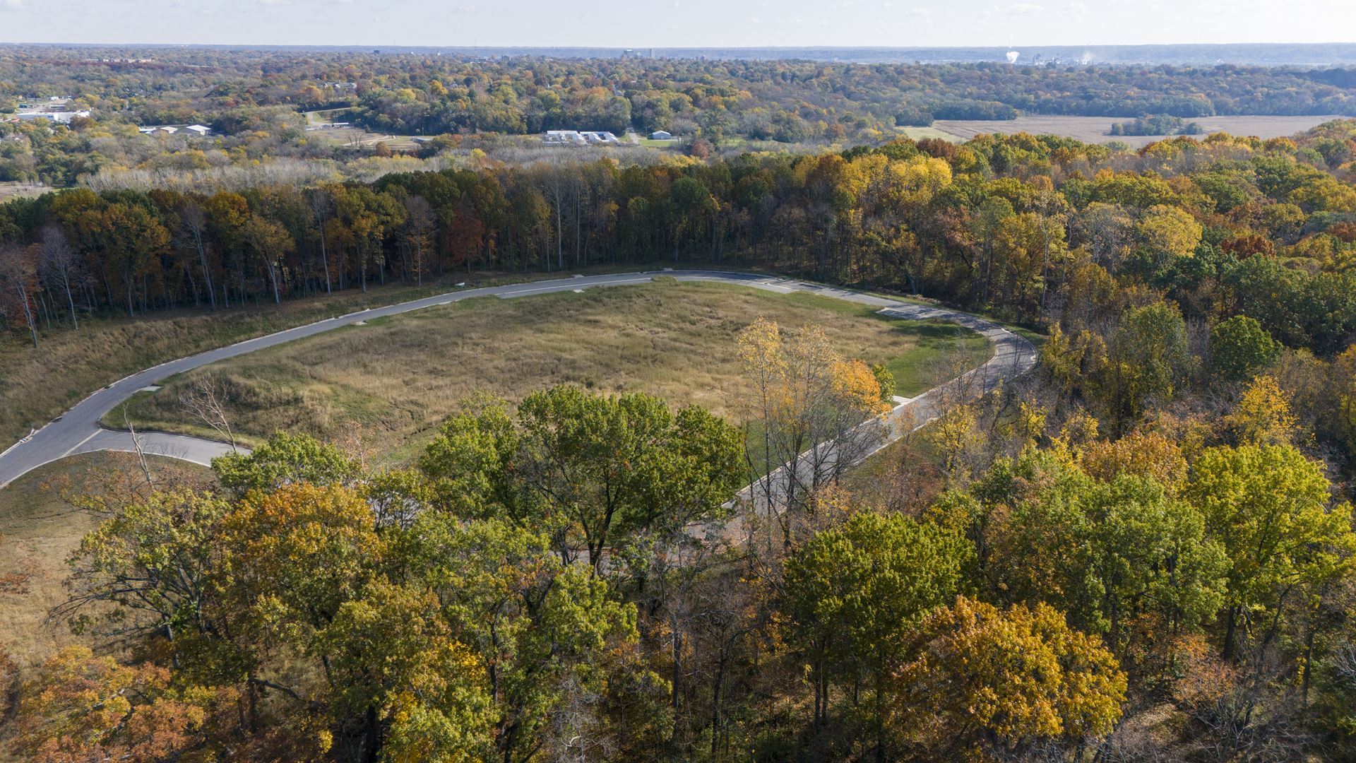 The temple seen from the air above its wooded bluff