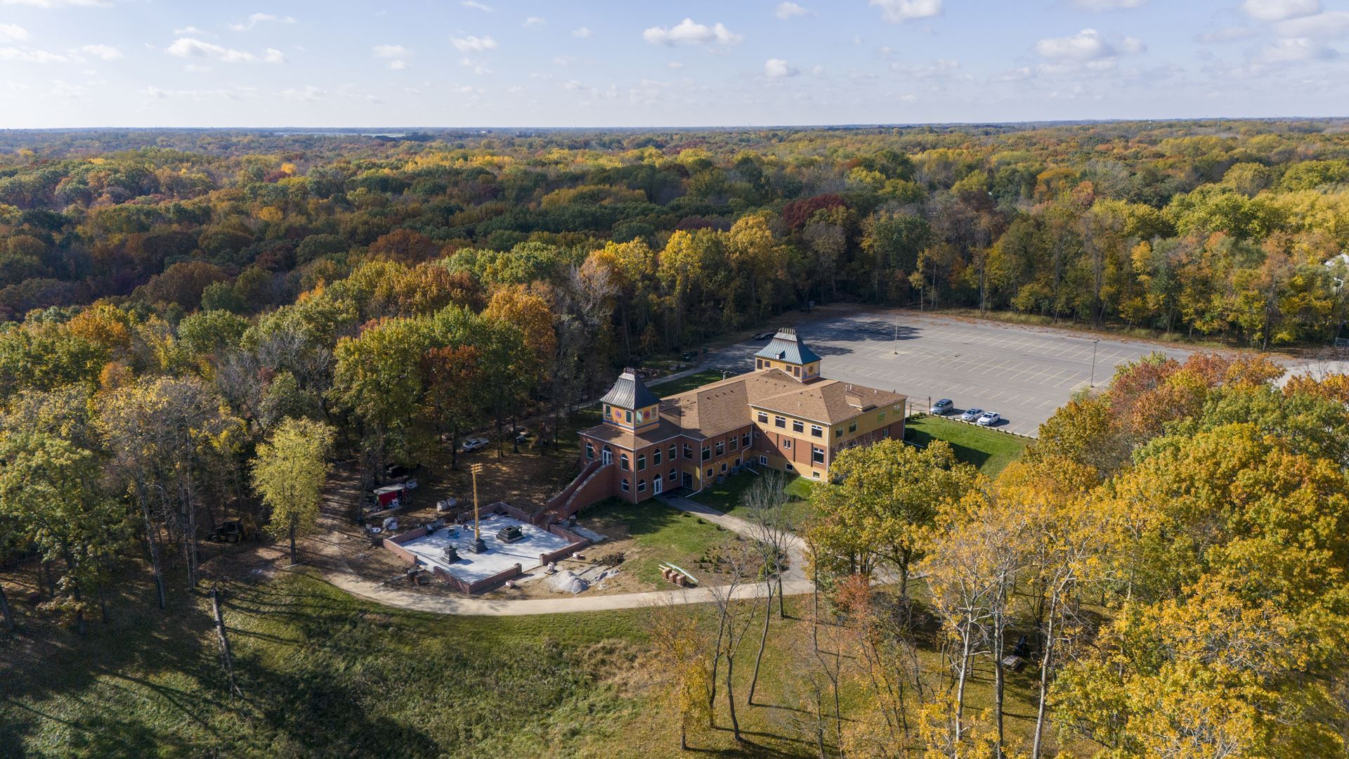 Aerial view of the Hindu Temple of Central Illinois and its wooded bluff setting